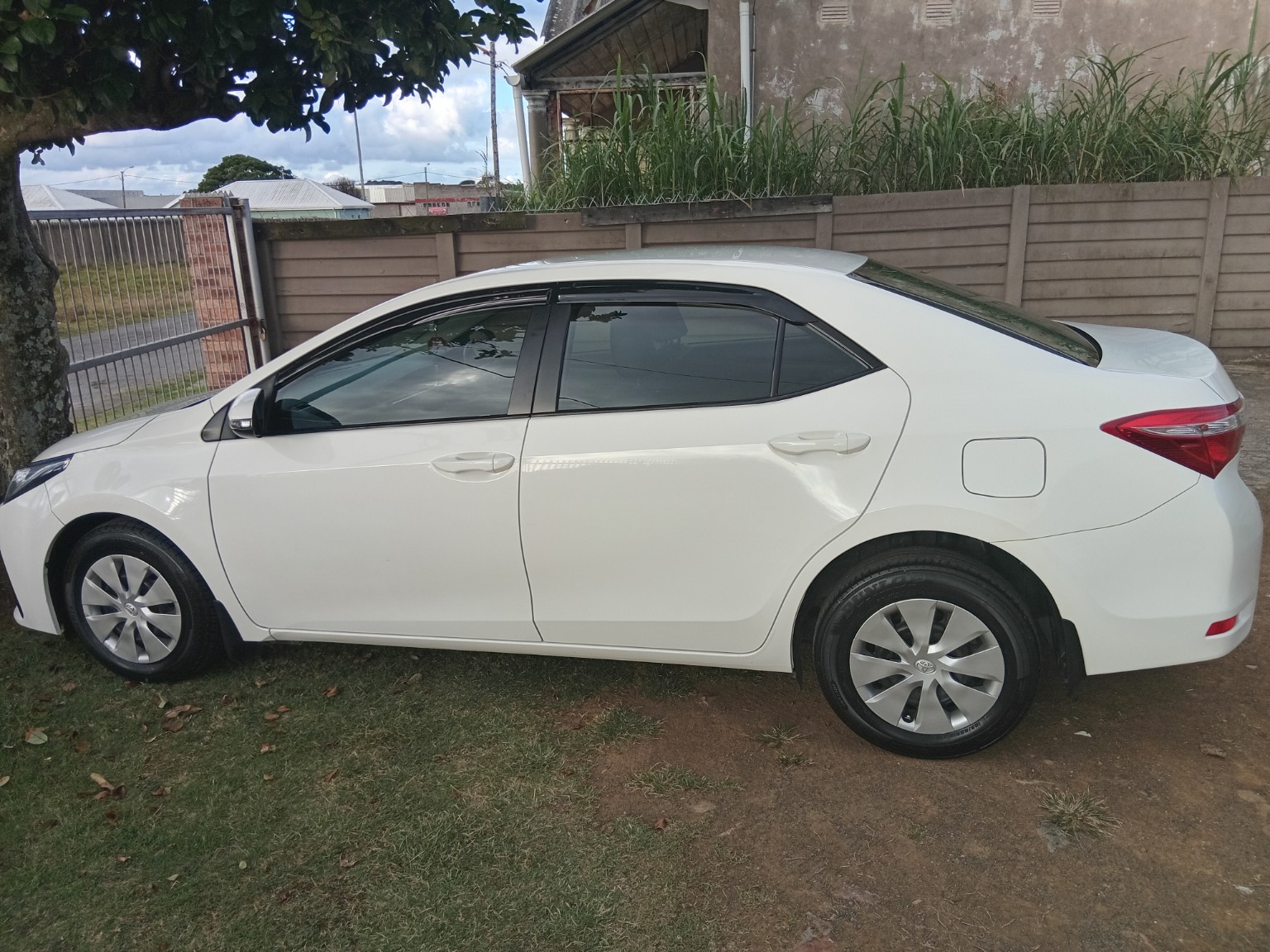 White passenger vehicle used for shuttle service